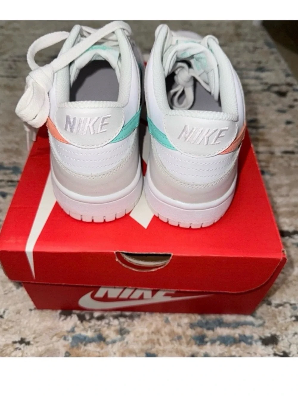 Nike White Low-Top Sneakers with Peach Swoosh